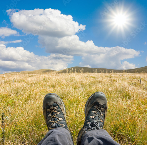 hikers boots on mountains meadow © Pavlo Klymenko