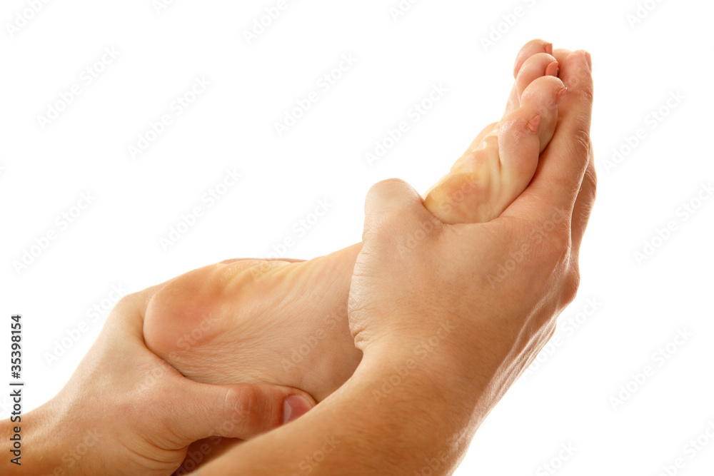 massage foot female close-up isolated on white massage foot female close-up isolated on white