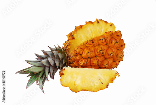 Fresh juicy pineapple with cut off slice photo