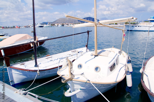 Alcudia Majorca port with llaut boats in marina photo