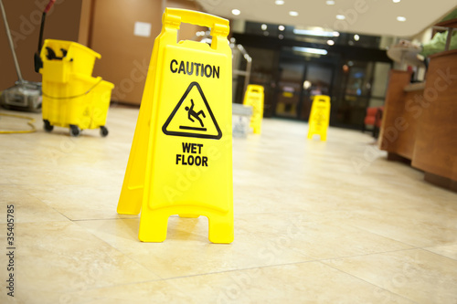 caution lobby mop bucket and sign