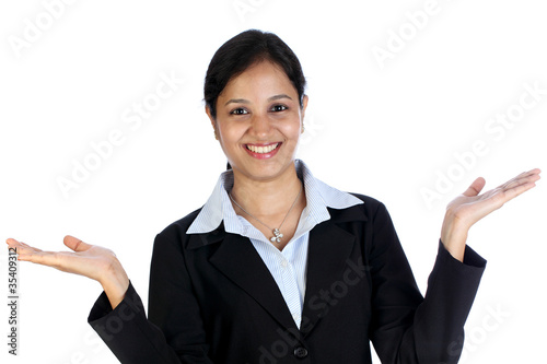 Excited young businesswoman against white background