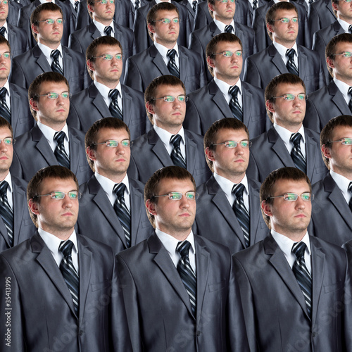 Many identical businessmen clones photo