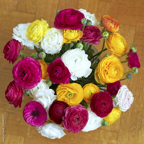 colorful buttercups bouquet, natural background © Dimitrios