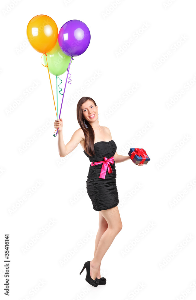Attractive woman holding ballons and gift Attractive woman holding ballons and gift