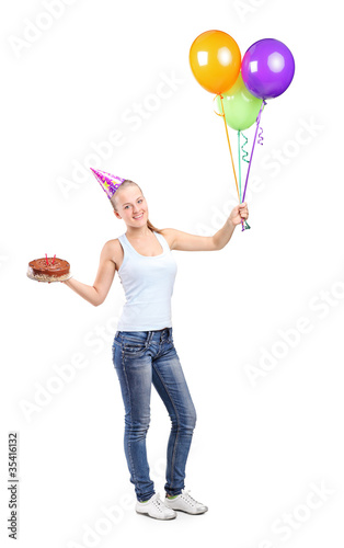 Attractive woman holding ballons and a cake