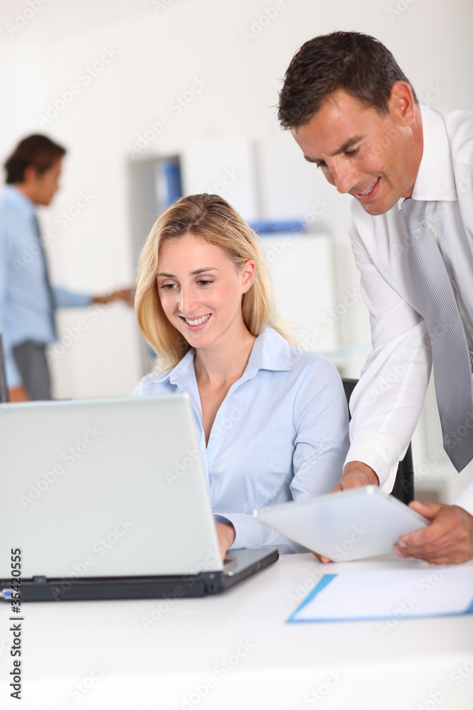 Office workers meeting with electronic tablet Office workers meeting with electronic tablet