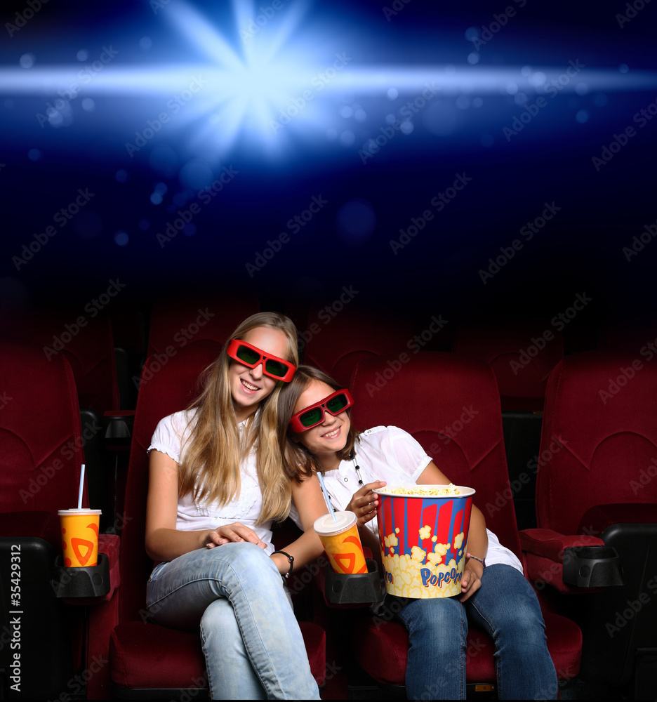Two young girls in cinema Two young girls in cinema