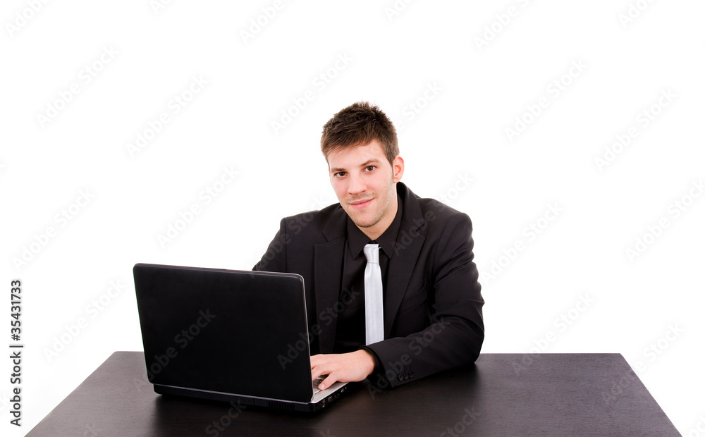 young business man working with is laptop at the desk