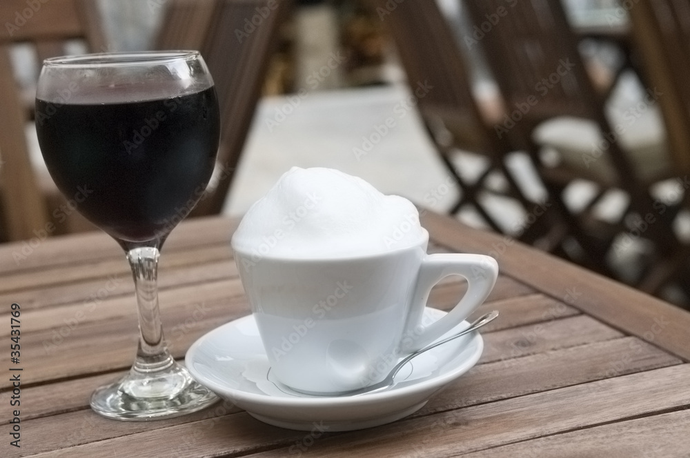 Coffee cup and red wine glass outdoor Coffee cup and red wine glass outdoor