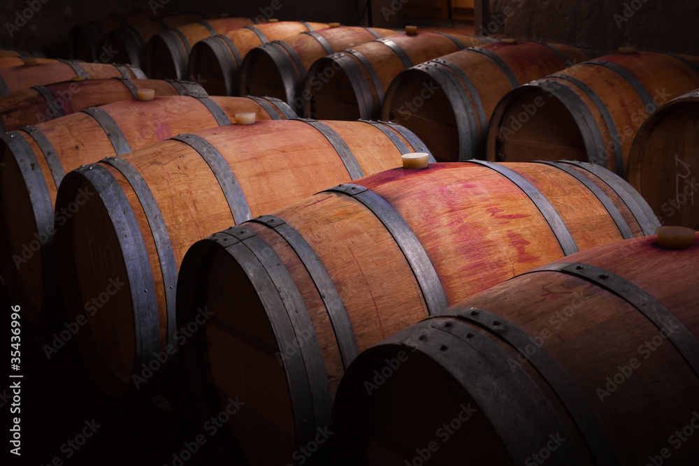 Wine barrels in an aging cellar of Ribera del Duero, Spain Wine barrels in an aging cellar of Ribera del Duero, Spain