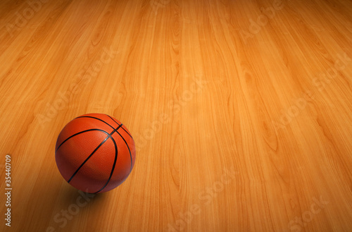 A basketball on wooden floor