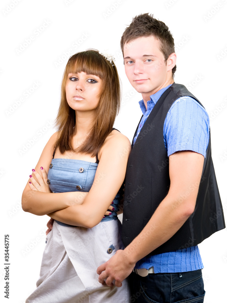 Portrait of a young handsome couple. Young man embraces woman. Portrait of a young handsome couple. Young man embraces woman.