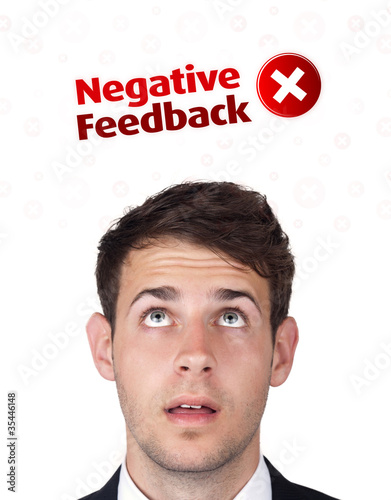 Young head looking at positive negative signs photo