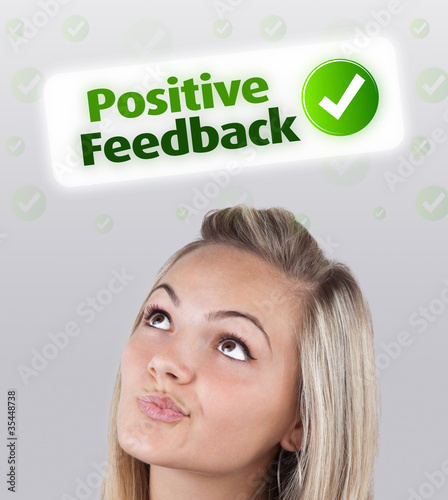 Young girl looking at positive negative signs photo