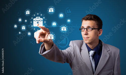 Businessman pressing modern business type of buttons