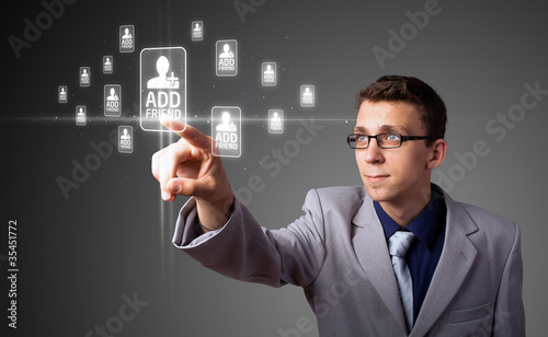 Businessman pressing modern social type of icons