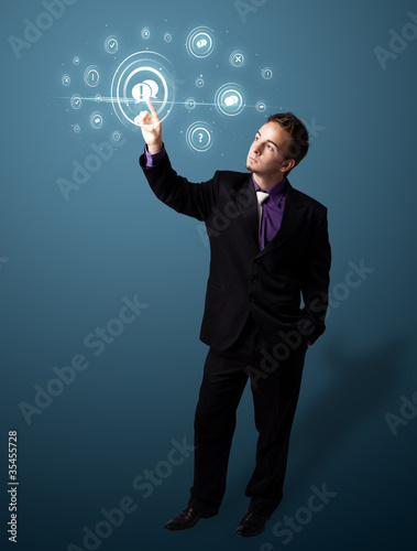 Businessman pressing modern social type of icons