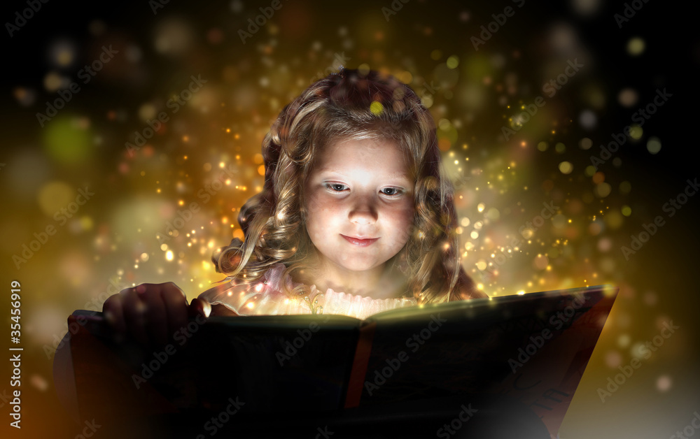 Child opening a magic gift box Child opening a magic gift box