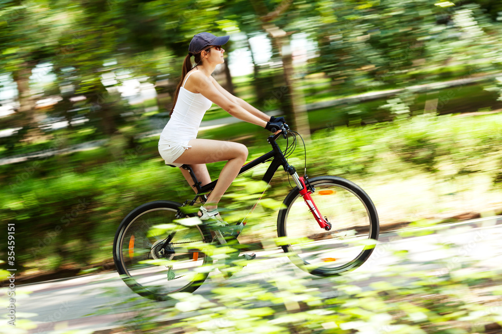 Naklejka premium Girl cycling