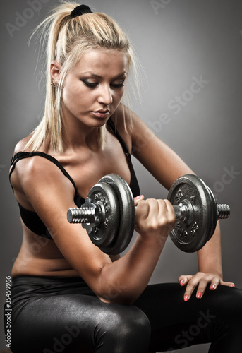 Young athletic woman doing workout