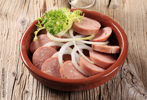 Sliced sausages and onion