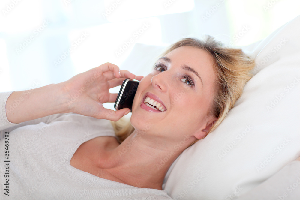 Portrait of beautiful young woman talking on mobile phone Portrait of beautiful young woman talking on mobile phone