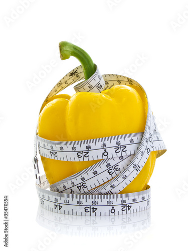 Yellow paprika with measure tape
