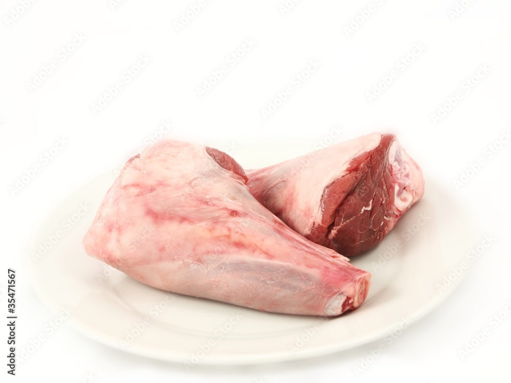 Fresh red meat, chops isolated on white plate Fresh red meat, chops isolated on white plate