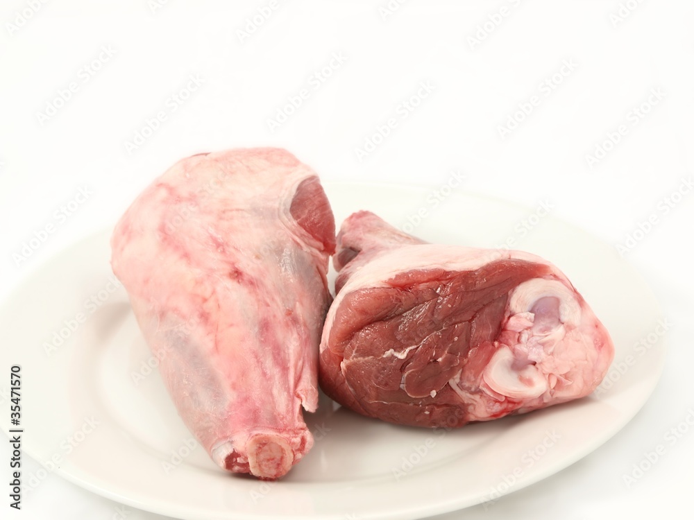 Fresh red meat, chops isolated on white plate Fresh red meat, chops isolated on white plate