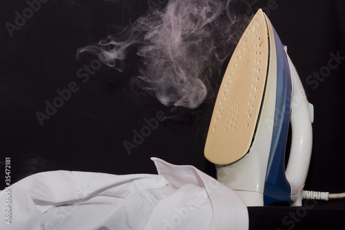 close up of ironing tool on white background