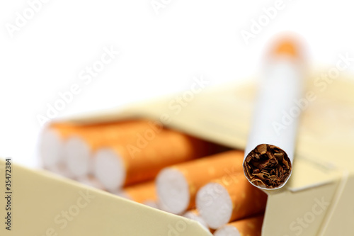 Close-up view on cigarette lying on pack