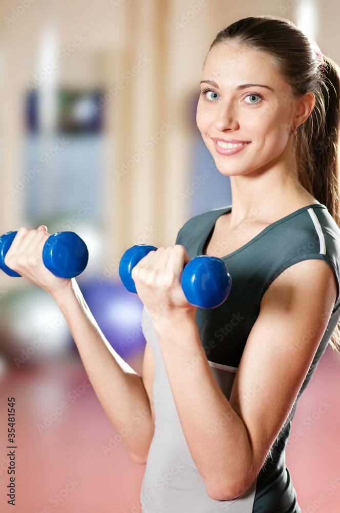 Beautiful sport woman doing power fitness exercise Beautiful sport woman doing power fitness exercise
