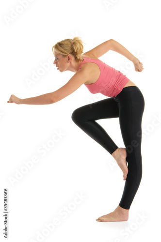 woman standing makes exercise
