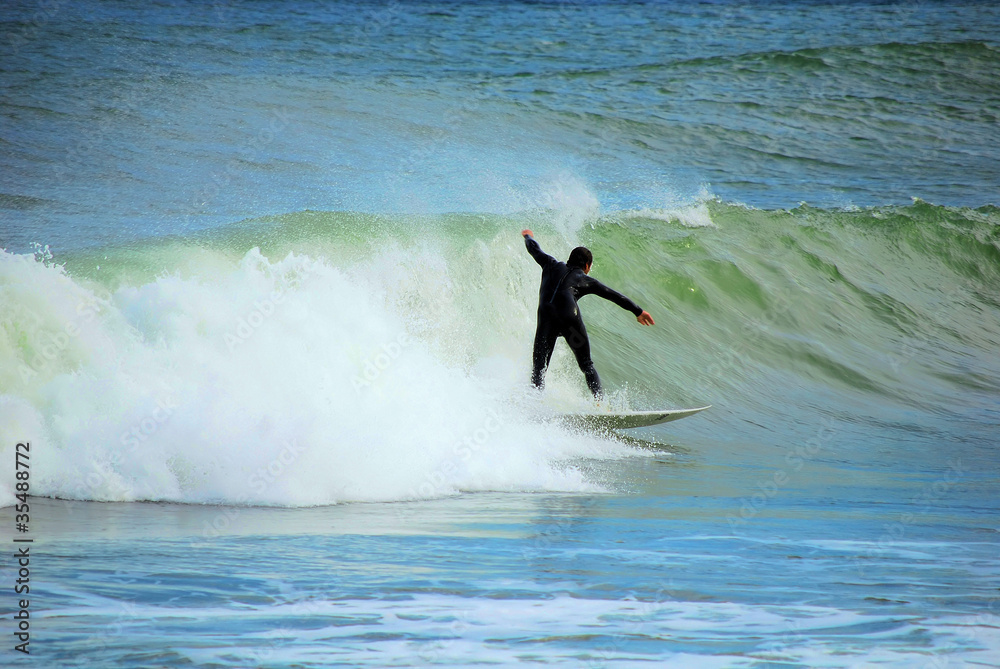 sportsman surfer on a sea wave
