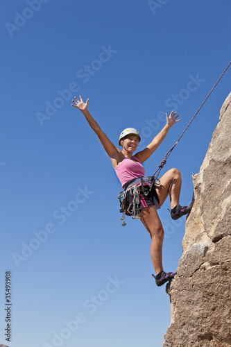 Female climber on the summit.