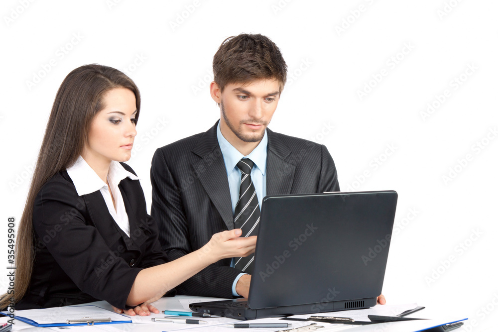 business people in elegant suits sitting at desk working business people in elegant suits sitting at desk working