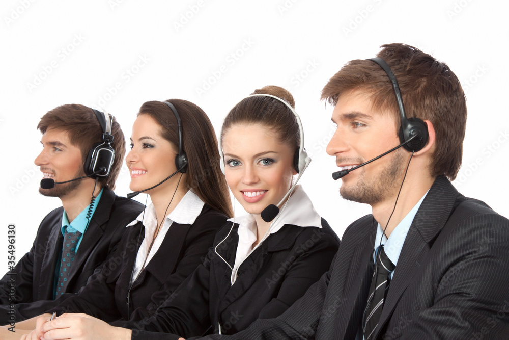 Smiling young businesspeople and colleagues in call center Smiling young businesspeople and colleagues in call center