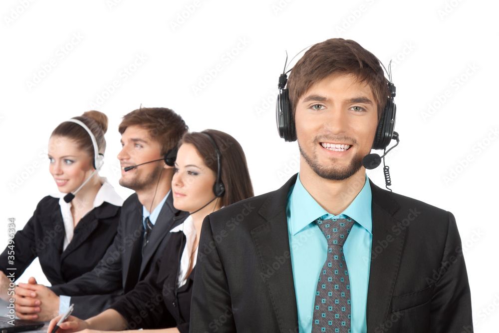 handsome young businessman and colleagues in call center handsome young businessman and colleagues in call center