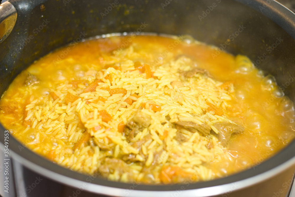 Rice, meat carrots and spices, cooking Uzbek pilaf. Rice, meat carrots and spices, cooking Uzbek pilaf.