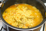 Rice, meat carrots and spices, cooking Uzbek pilaf.