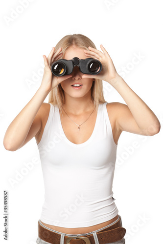 Front view of blond woman looking through binoculars