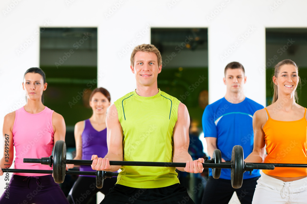 Fototapeta premium Fitness people with barbell in gym