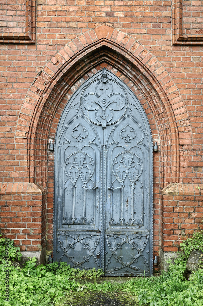 Old gothic church metal door