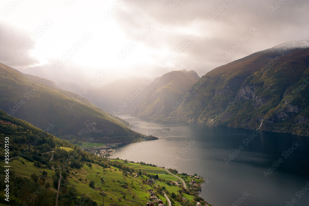 houses standing on a fjord coast at the overcast day houses standing on a fjord coast at the overcast day