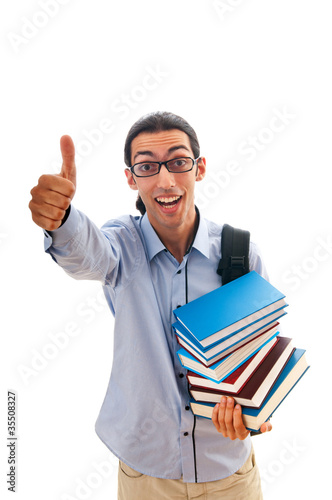 Student with stack of books on white © Elnur