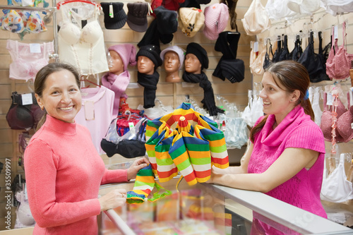 Saleswoman and customer  at  counter photo