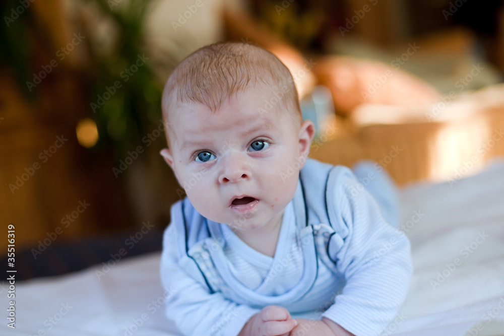 Baby boy with blue eyes looking at the camera Baby boy with blue eyes looking at the camera