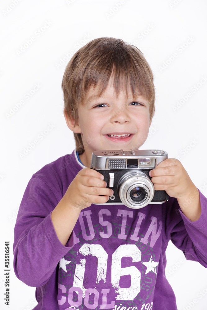 Glückliches Kind mit kamera