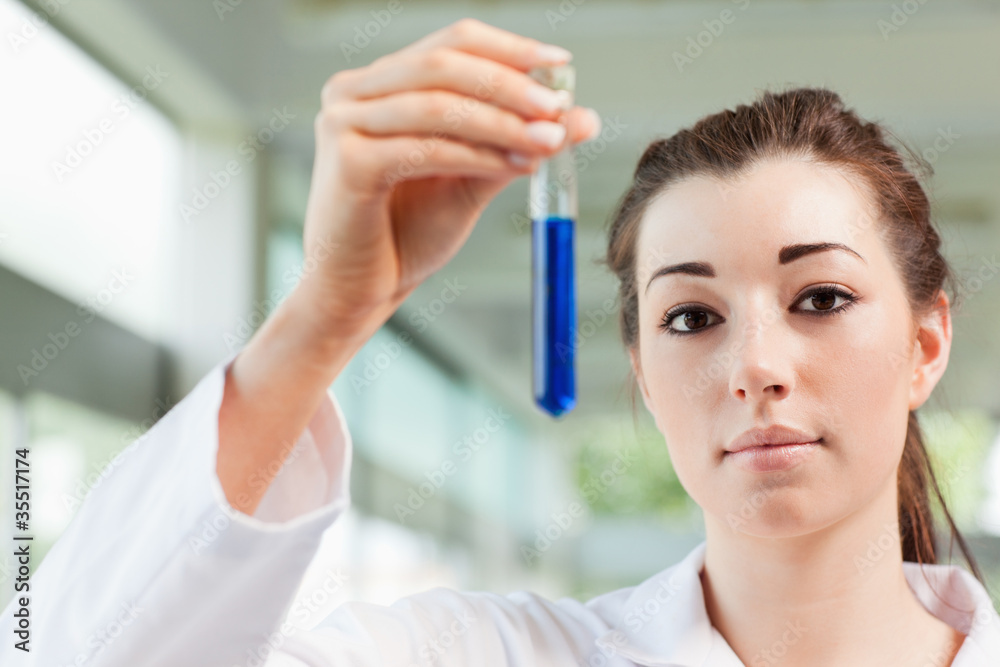 Cute student holding a test tube Cute student holding a test tube